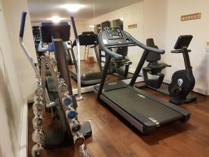a gym with several exercise bikes and a treadmill at Hotel Süd Graz in Graz