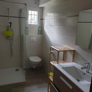 a bathroom with a shower and a toilet and a sink at Oustal in Savines