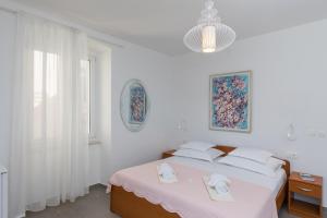 Posteľ alebo postele v izbe v ubytovaní Guest House Libertas