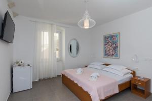 Posteľ alebo postele v izbe v ubytovaní Guest House Libertas