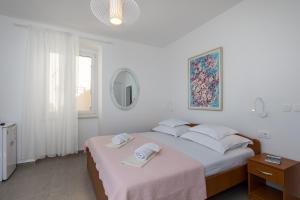 Posteľ alebo postele v izbe v ubytovaní Guest House Libertas