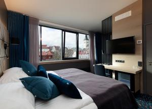 Postel nebo postele na pokoji v ubytování Kalev Spa Hotel & Waterpark