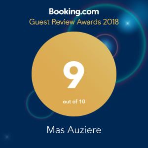 a yellow circle with the number nine on it with the text quest review awards at Mas Auziere in Le Martinet