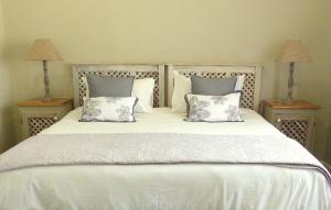 Ένα ή περισσότερα κρεβάτια σε δωμάτιο στο The Kraal Addo