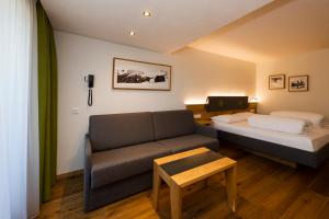 Ein Bett oder Betten in einem Zimmer der Unterkunft Hotel Bergkranz