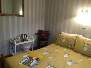 A bed or beds in a room at Alltonside Guest House 
