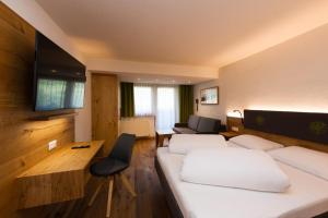 Ein Bett oder Betten in einem Zimmer der Unterkunft Hotel Bergkranz