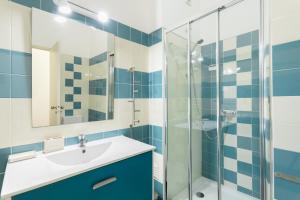 a bathroom with a sink and a shower at FLH Rossio's Flat in Lisbon