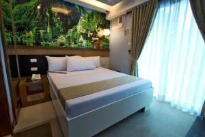 Postel nebo postele na pokoji v ubytování Eurotel Boracay