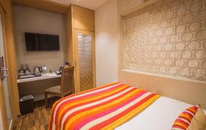 Postel nebo postele na pokoji v ubytování Hotel Bawa Continental