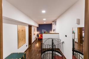 a hallway with a staircase and a living room at B&B i Maestri in Naples