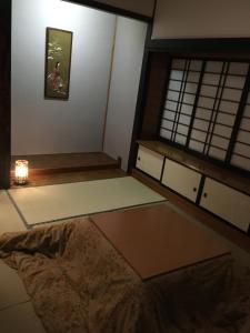 Postel nebo postele na pokoji v ubytování Shinshu Wakaho Gibier B&B