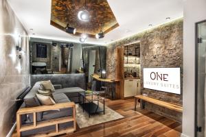 a living room with a couch and a one owner suite at One Luxury Suites in Belgrade