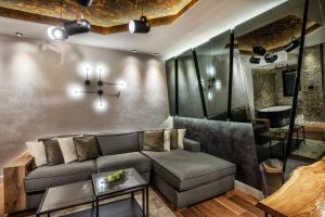 a living room with a couch and a table at One Luxury Suites in Belgrade