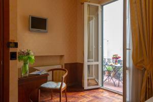 TV a/nebo společenská místnost v ubytování Hotel Boccaccio