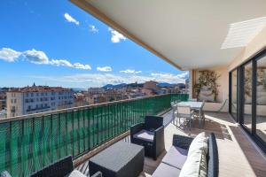 a balcony with a view of a city at Residence Provencal - Luxurious - 300m Palais - LRA CANNES in Cannes