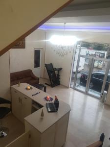 a living room with a car parked in a garage at Hotel LEADER in Tbilisi City