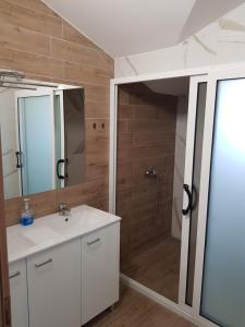a bathroom with a sink and a shower at Mediteran B&B in Prozor +51 photos