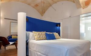
Cama o camas de una habitación en Divina Suites Hotel Singular -Adults Only
