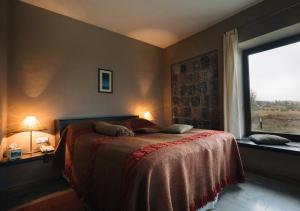Postel nebo postele na pokoji v ubytování Tufenkian Avan Marak Tsapatagh Hotel