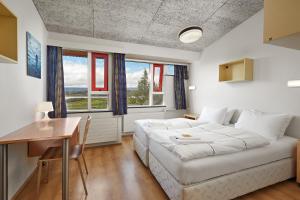 Llit o llits en una habitació de Hotel Edda Egilsstadir 22 fotos més