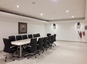 a conference room with a table and chairs at Luton Vacation Homes -Sea View Marina Promenade in Dubai