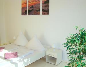 Voodi või voodid majutusasutuse Rooms & Apartments near Zoologischer Garten toas