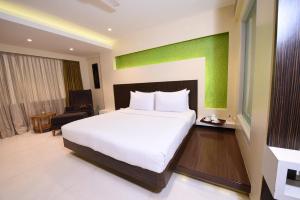 Postel nebo postele na pokoji v ubytování Hotel Bawa Suites