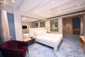 Postel nebo postele na pokoji v ubytování Hotel Bawa Suites