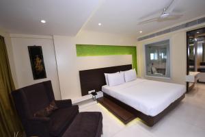 Postel nebo postele na pokoji v ubytování Hotel Bawa Suites