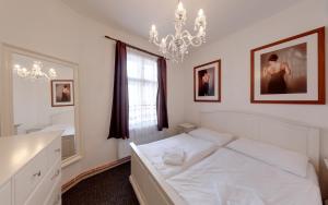 Postel nebo postele na pokoji v ubytování Apartmány Tábor