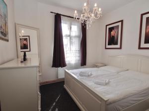 Postel nebo postele na pokoji v ubytování Apartmány Tábor