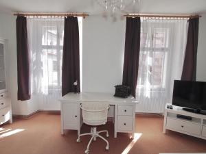 TV a/nebo společenská místnost v ubytování Apartmány Tábor