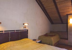 Postel nebo postele na pokoji v ubytování Tufenkian Avan Marak Tsapatagh Hotel