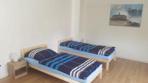 A bed or beds in a room at ABC-Monteurzimmer