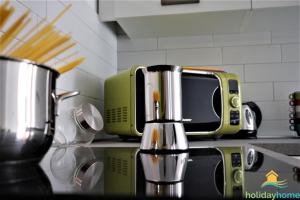 a kitchen with a counter with a toaster and a toaster at Apartment Antica Corte in Arco