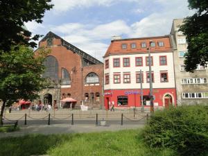 a group of buildings on a street in a city at MoHo E Hostel in Wrocław