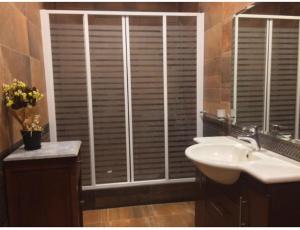 a bathroom with a sink and a window with blinds at El-Shorouk Housing gate2 in Cairo +17 photos