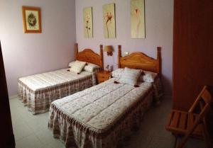 a bedroom with two beds in a room at ESPAGNE - ALICANTE - GUARDAMAR DEL SEGURA in Guardamar del Segura