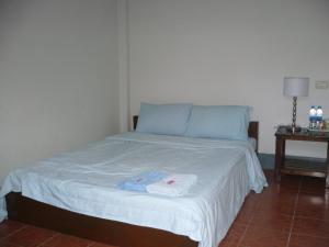 Postel nebo postele na pokoji v ubytování Pai Klang Vieng