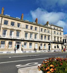 a large building on the side of a street at The Jubilee Hotel - with Spa and Restaurant and Entertainment in Weymouth