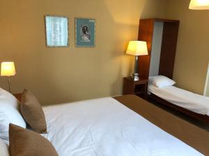 Voodi või voodid majutusasutuse Hotel Johannes Vermeer Delft toas