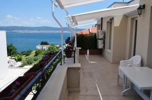 a balcony with a view of the ocean at St. George Apartments in Nesebar