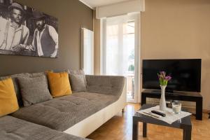 a living room with a couch and a tv at Locarno - Casa Pioda in Locarno