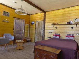 Un ou plusieurs lits dans un hébergement de l'établissement La maison du lac Chalain