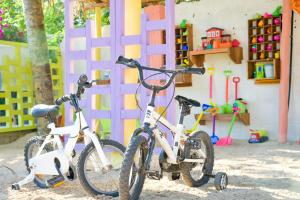 two bikes are parked in front of a playground at Filao Beach by Sansi in Uroa