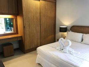 Postel nebo postele na pokoji v ubytování The Nest Samui