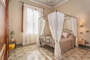 Postel nebo postele na pokoji v ubytování Villa Ricci Suites