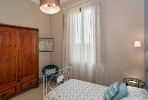 Postel nebo postele na pokoji v ubytování Villa Ricci Suites