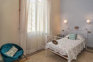 Postel nebo postele na pokoji v ubytování Villa Ricci Suites